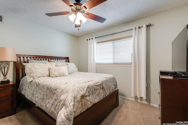 16519 Burr Hill, San Antonio, TX 78247 - bedroom featuring light carpet, a textured ceiling, and a ceiling fan