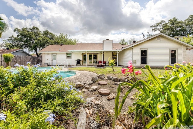 16519 Burr Hill, San Antonio, TX 78247 - rear view of property with a chimney and a patio area