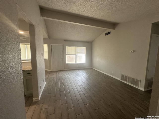 11618 Spring Trail St, San Antonio, TX 78249 - unfurnished living room featuring a textured ceiling, dark wood-style flooring, a textured wall, and baseboards