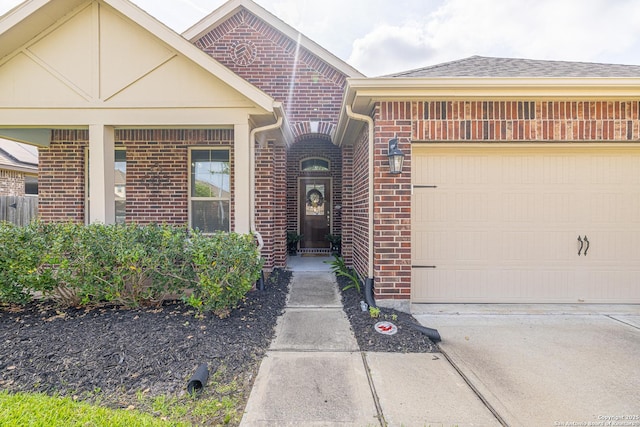 2705 Merlin Ln, Pearland, TX 77581 - doorway to property with brick siding, an attached garage, driveway, and roof with shingles