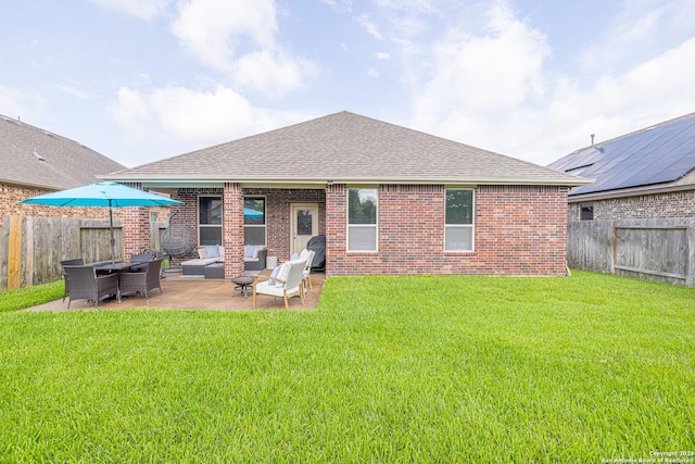 2705 Merlin Ln, Pearland, TX 77581 - rear view of property with outdoor lounge area, a shingled roof, brick siding, and a patio area