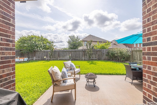 2705 Merlin Ln, Pearland, TX 77581 - view of patio with an outdoor fire pit