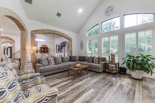 10 Kings Tower, San Antonio, TX 78257 - living room with arched walkways, high vaulted ceiling, wood finished floors, and recessed lighting