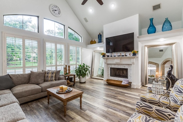 10 Kings Tower, San Antonio, TX 78257 - living room featuring high vaulted ceiling, ceiling fan, a premium fireplace, wood finished floors, and recessed lighting