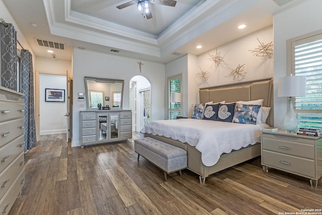 10 Kings Tower, San Antonio, TX 78257 - bedroom with dark wood-type flooring, crown molding, a tray ceiling, arched walkways, and recessed lighting