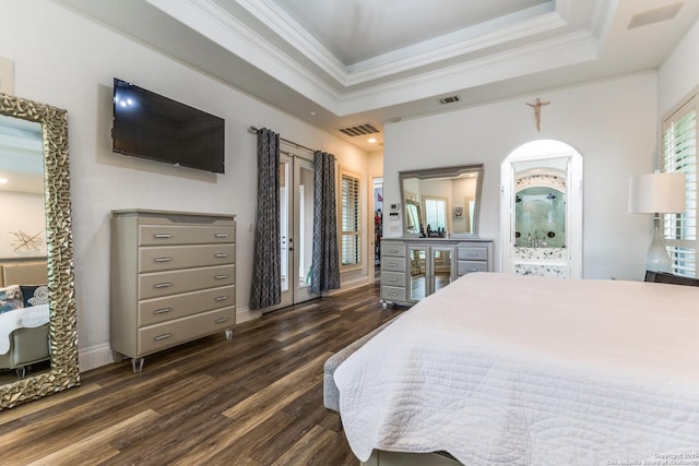 10 Kings Tower, San Antonio, TX 78257 - bedroom featuring dark wood finished floors, ornamental molding, ensuite bath, a tray ceiling, and baseboards
