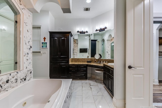 10 Kings Tower, San Antonio, TX 78257 - full bathroom with a jetted tub, vanity, and marble finish flooring