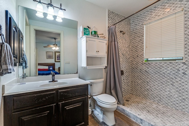 10 Kings Tower, San Antonio, TX 78257 - full bathroom with tiled shower, toilet, vanity, wood finished floors, and ensuite bath