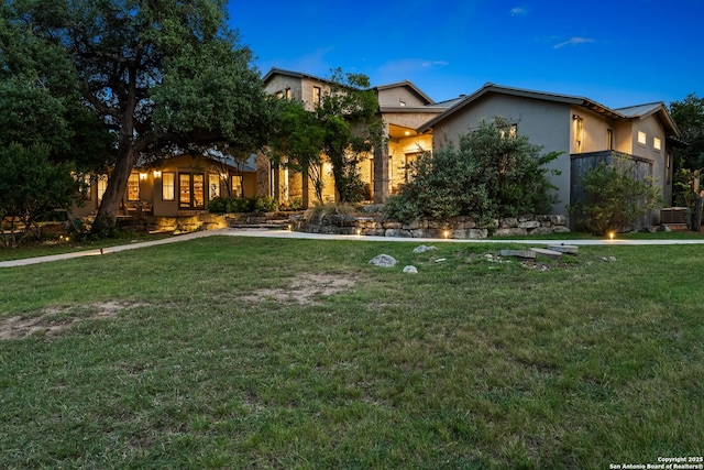 195 Desert Flower, Spring Branch, TX 78070 - view of front of home with a front yard, stucco siding, and cooling unit