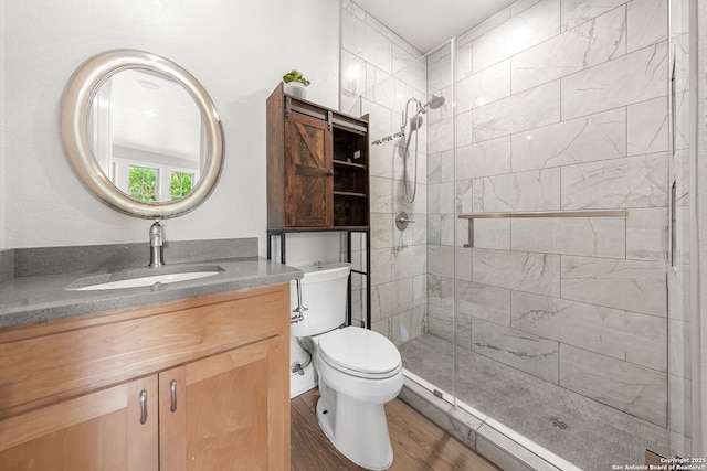 195 Desert Flower, Spring Branch, TX 78070 - full bath featuring a shower stall, vanity, wood finished floors, and toilet