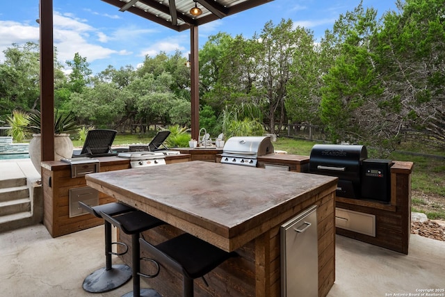 195 Desert Flower, Spring Branch, TX 78070 - view of patio / terrace featuring view of wooded area and an outdoor pool