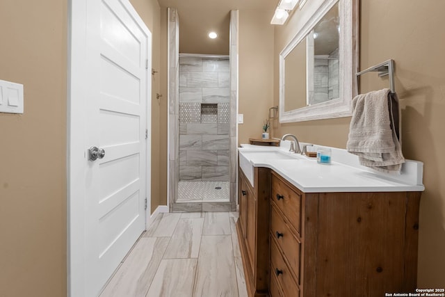 195 Desert Flower, Spring Branch, TX 78070 - bathroom with marble finish flooring, vanity, a shower stall, and recessed lighting