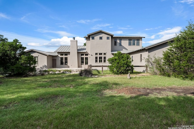 195 Desert Flower, Spring Branch, TX 78070 - back of house featuring a standing seam roof, metal roof, a chimney, and stucco siding