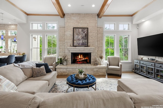 195 Desert Flower, Spring Branch, TX 78070 - living room with wood finished floors, beam ceiling, a fireplace, baseboards, and recessed lighting
