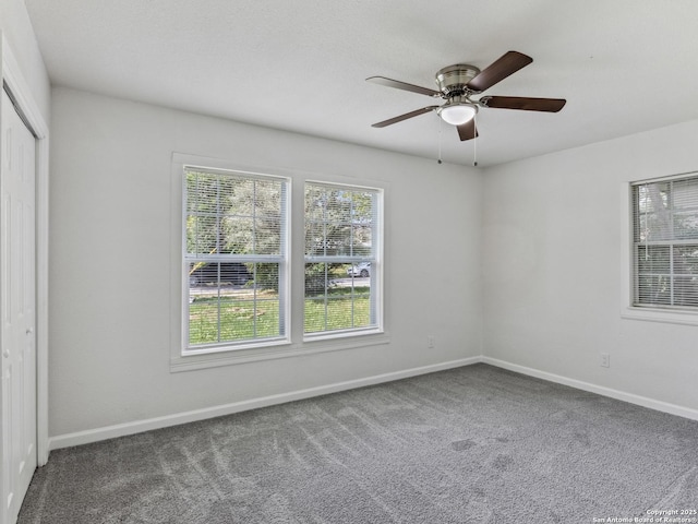 942 San Angelo, San Antonio, TX 78201 - unfurnished bedroom with carpet, baseboards, a closet, and a ceiling fan