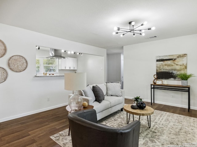 942 San Angelo, San Antonio, TX 78201 - living area with a chandelier, dark wood-style flooring, and baseboards