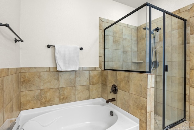 9815 Leubeck Rnch, Helotes, TX 78023 - full bathroom featuring a garden tub and a shower stall