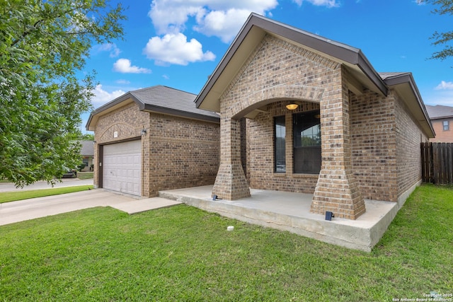 9815 Leubeck Rnch, Helotes, TX 78023 - view of front facade featuring brick siding, a garage, and driveway