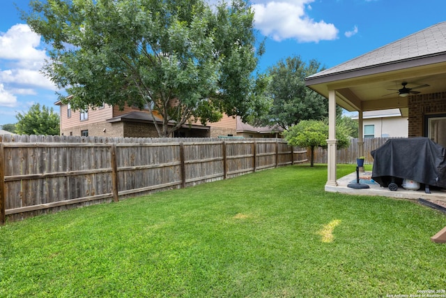 9815 Leubeck Rnch, Helotes, TX 78023 - view of yard featuring a ceiling fan and a patio