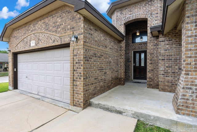 9815 Leubeck Rnch, Helotes, TX 78023 - entrance to property featuring brick siding, a garage, and concrete driveway