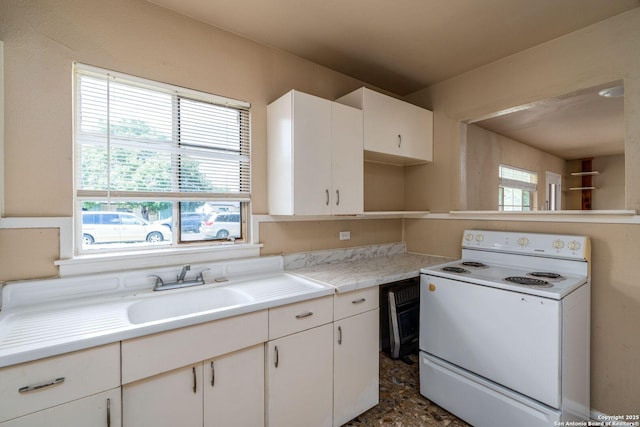 222 Laurelwood, San Antonio, TX 78213 - kitchen with white electric range, a sink, light countertops, and white cabinetry