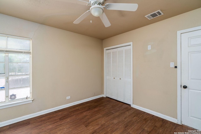 222 Laurelwood, San Antonio, TX 78213 - unfurnished bedroom featuring dark wood finished floors, baseboards, a closet, and a ceiling fan