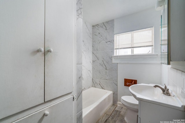 222 Laurelwood, San Antonio, TX 78213 - bathroom featuring vanity, toilet, wood finished floors, and shower / washtub combination