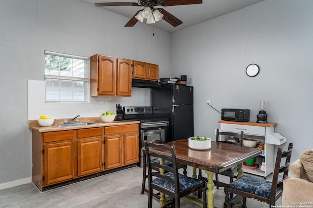 222 Laurelwood, San Antonio, TX 78213 - kitchen featuring black appliances, backsplash, under cabinet range hood, ceiling fan, and brown cabinetry