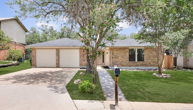 9807 Boulder Hill, San Antonio, TX 78250 - ranch-style house featuring a front yard, driveway, a garage, and brick siding