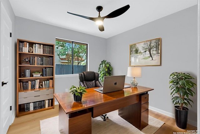 9807 Boulder Hill, San Antonio, TX 78250 - home office with a ceiling fan, light wood-style flooring, and baseboards