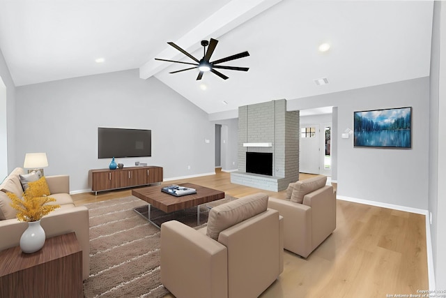 9807 Boulder Hill, San Antonio, TX 78250 - living area with a ceiling fan, baseboards, a fireplace, and light wood-type flooring