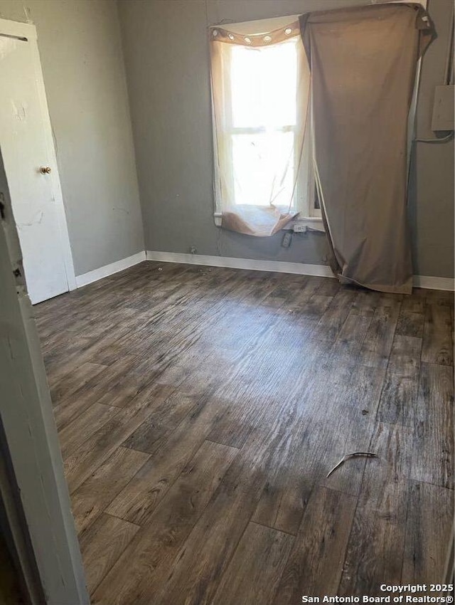 330 E Hart, San Antonio, TX 78214 - empty room featuring wood finished floors and baseboards