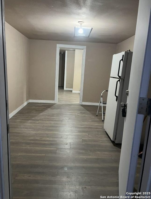 330 E Hart, San Antonio, TX 78214 - kitchen featuring freestanding refrigerator, wood finished floors, and a textured ceiling