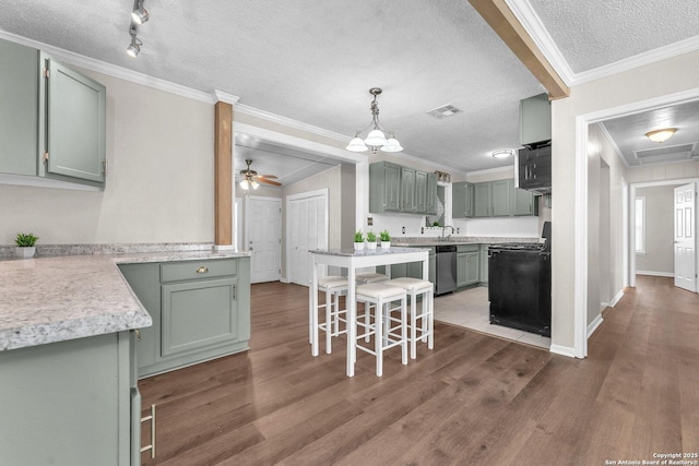 239 Banbridge, San Antonio, TX 78223 - kitchen with a textured ceiling, range, crown molding, wood finished floors, and a breakfast bar area