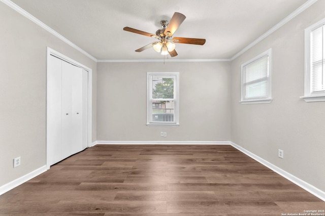239 Banbridge, San Antonio, TX 78223 - unfurnished bedroom featuring crown molding, a closet, wood finished floors, baseboards, and ceiling fan