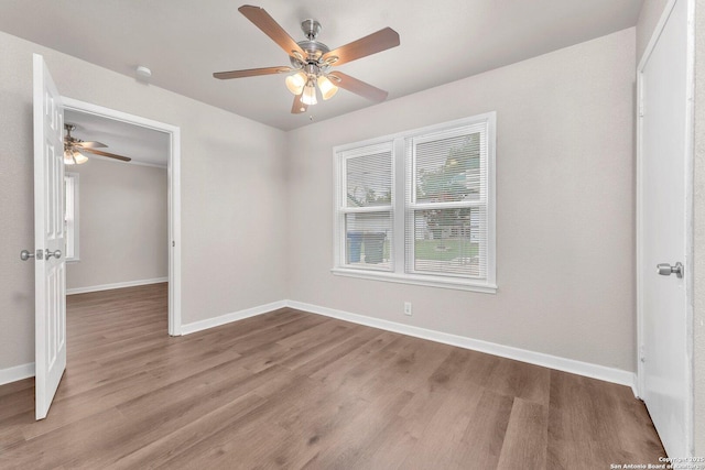 239 Banbridge, San Antonio, TX 78223 - unfurnished bedroom with light wood finished floors, baseboards, a ceiling fan, and a closet