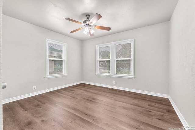 239 Banbridge, San Antonio, TX 78223 - unfurnished room with wood finished floors, ceiling fan, and baseboards