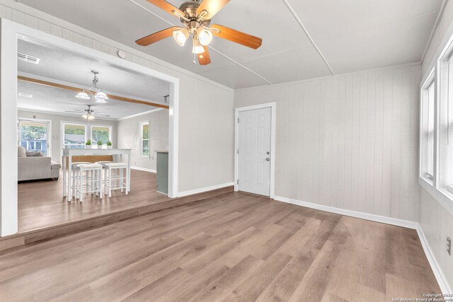 239 Banbridge, San Antonio, TX 78223 - living room featuring ceiling fan, wood finished floors, a chandelier, baseboards, and crown molding