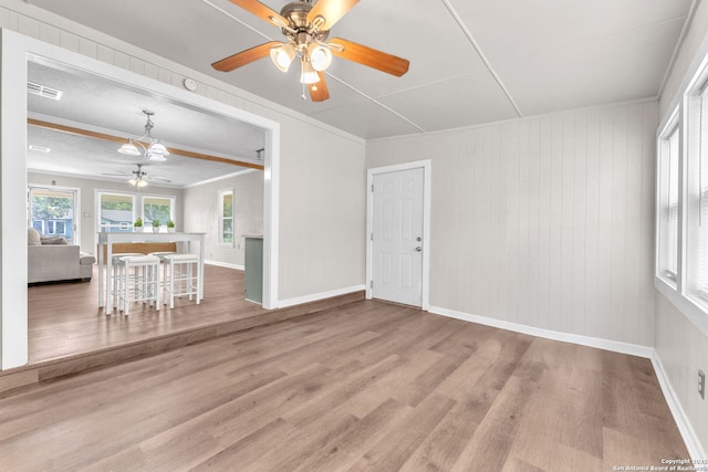 239 Banbridge, San Antonio, TX 78223 - living room with a ceiling fan, wood finished floors, a chandelier, baseboards, and ornamental molding