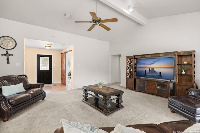585 Oak Bend Dr, Bandera, TX 78003 - carpeted living area with a barn door, a ceiling fan, and baseboards