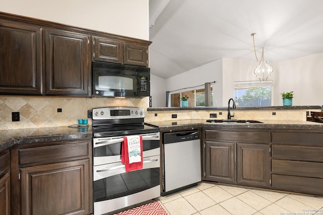 585 Oak Bend Dr, Bandera, TX 78003 - kitchen featuring appliances with stainless steel finishes, a sink, dark countertops, tasteful backsplash, and dark brown cabinetry
