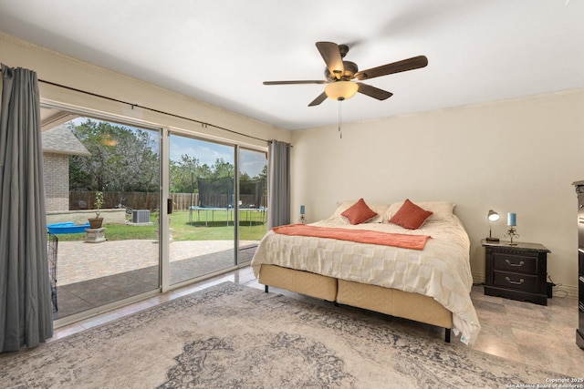 585 Oak Bend Dr, Bandera, TX 78003 - bedroom with access to outside, multiple windows, and ceiling fan