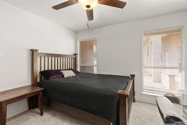585 Oak Bend Dr, Bandera, TX 78003 - bedroom with light colored carpet and ceiling fan