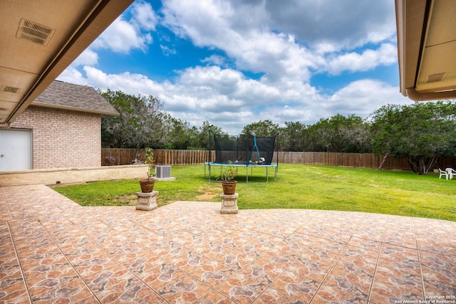 585 Oak Bend Dr, Bandera, TX 78003 - view of patio / terrace with a trampoline and central AC unit