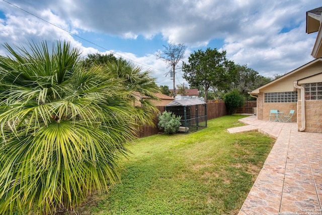 585 Oak Bend Dr, Bandera, TX 78003 - view of yard featuring an outdoor structure and a patio area