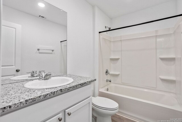 5455 Daphne Path, San Antonio, TX 78253 - bathroom with vanity,  shower combination, toilet, and wood finished floors