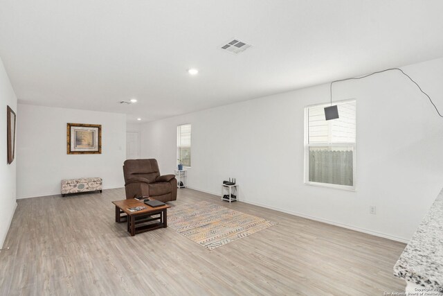 5455 Daphne Path, San Antonio, TX 78253 - living area featuring healthy amount of natural light, wood finished floors, recessed lighting, and baseboards