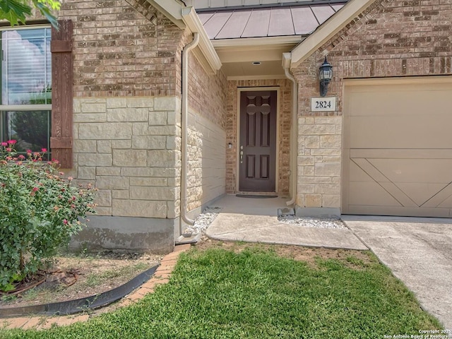 2824 Lake Highlands, Schertz, TX 78108 - entrance to property with a standing seam roof, a garage, metal roof, stone siding, and brick siding