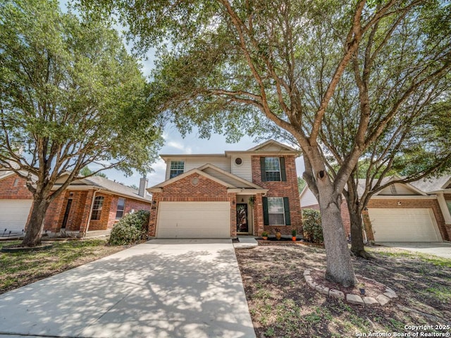 520 Foxford Run Dr, Schertz, TX 78108 - traditional-style house with concrete driveway, brick siding, and a garage