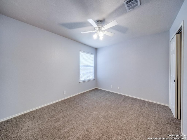 520 Foxford Run Dr, Schertz, TX 78108 - unfurnished bedroom with carpet flooring, baseboards, a textured ceiling, a ceiling fan, and a closet